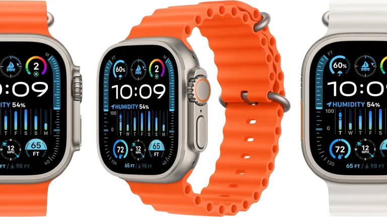 orange and white apple watch ultras on a plain background