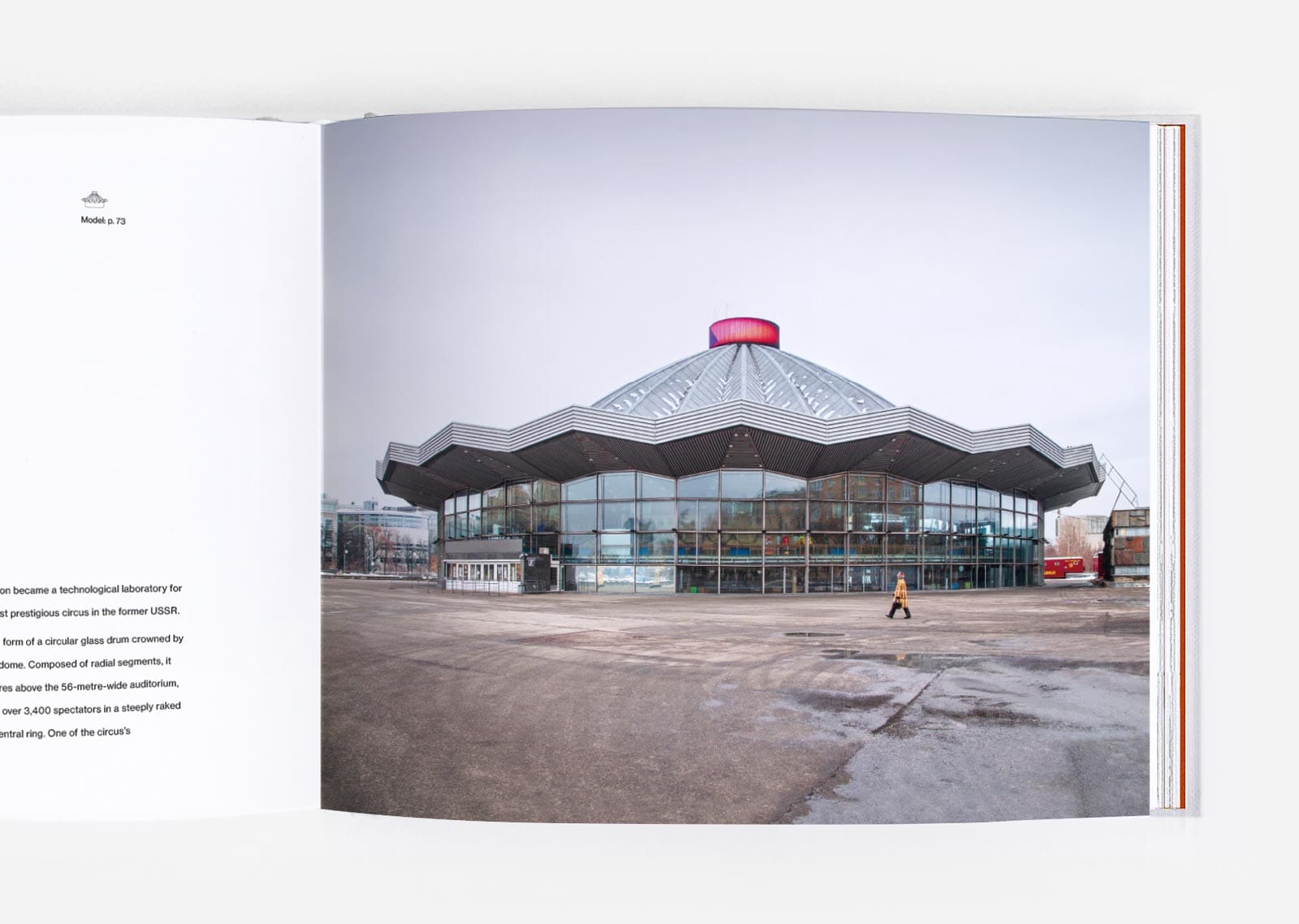 a spread from the book 'Cirk' depicting a round modernist building