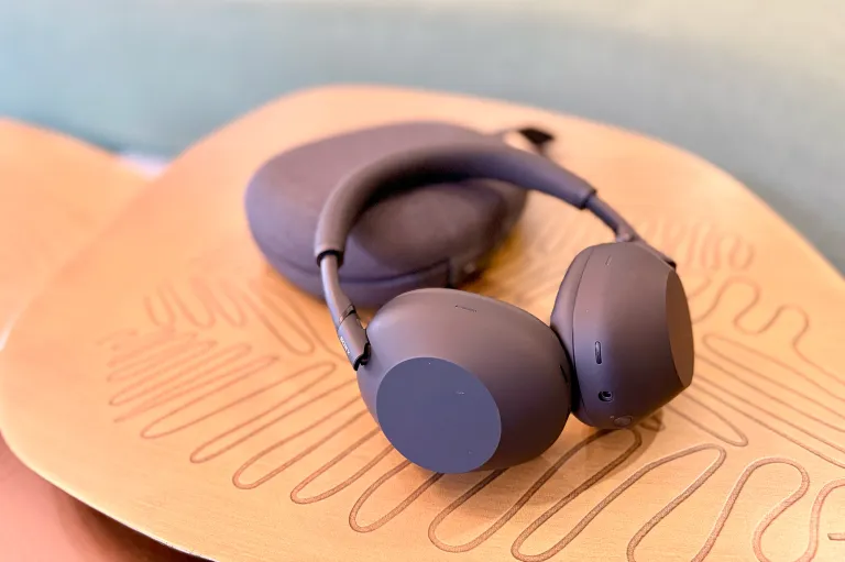 Sony WH-1000XM6 Bluetooth ANC headphones in Black sitting on a retromodern coffee table