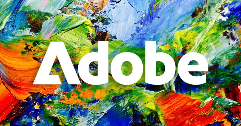 Напис «Adobe» жирним шрифтом, білим кольором на тлі яскравої, багатобарвної абстрактної олійної картини.
