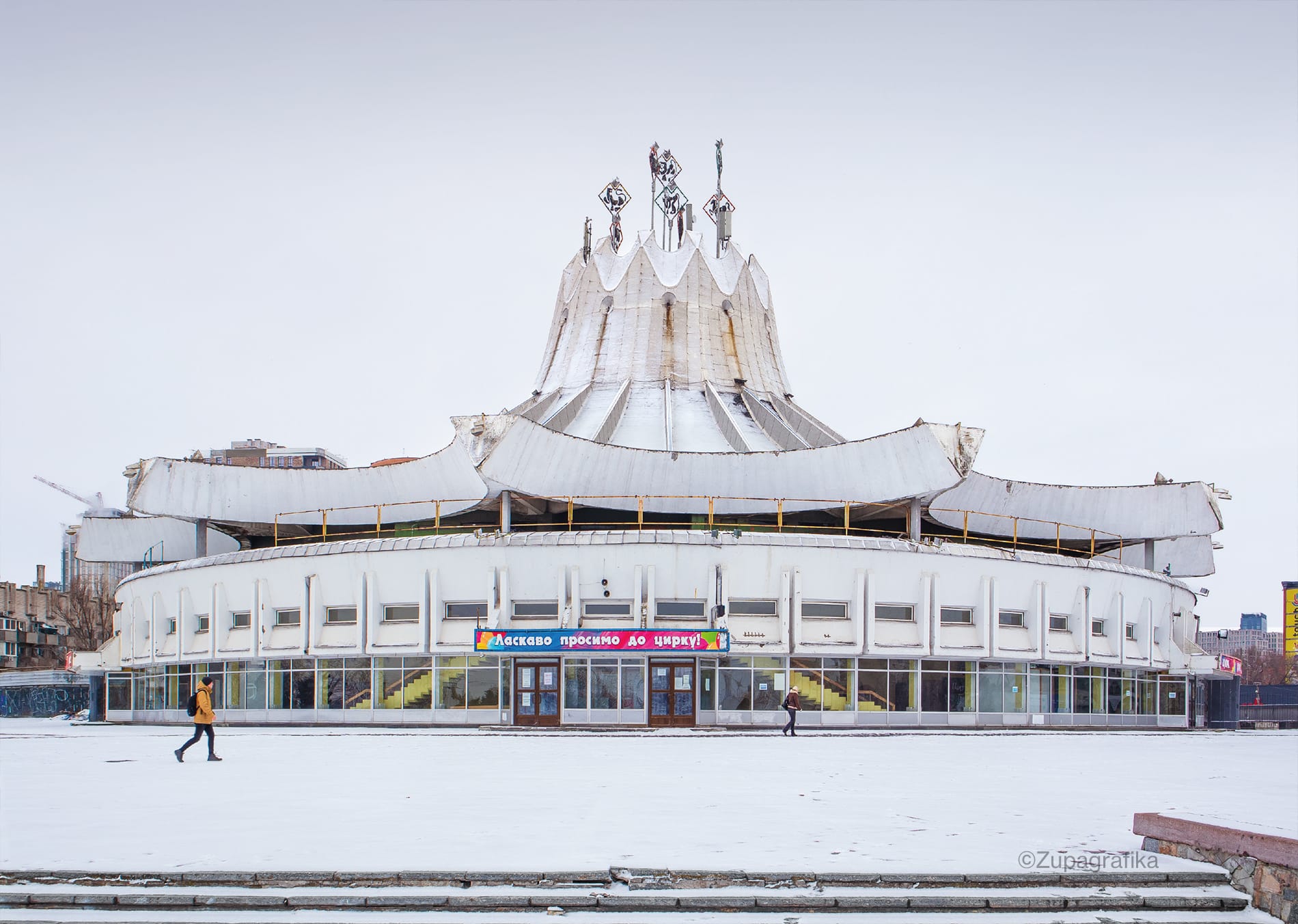a brutalist arena in the winter