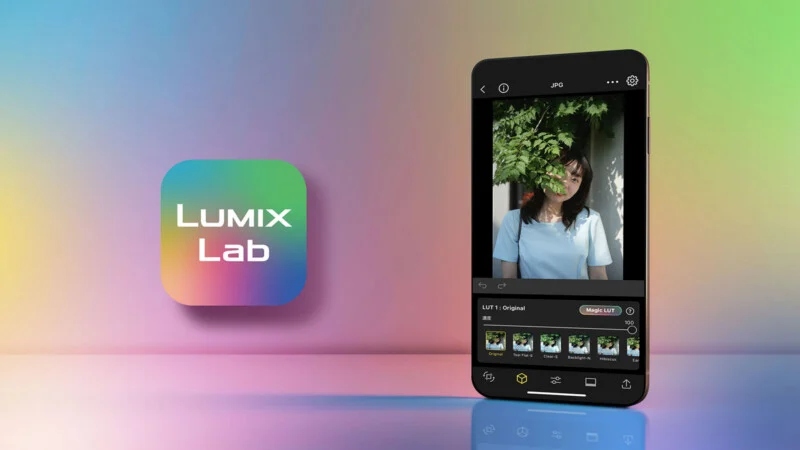 Смартфон відображає інтерфейс програми Lumix Lab, екран редагування фото з переліком LUT-фільтрів, поруч із барвистим квадратним значком програми на градієнтному тлі.